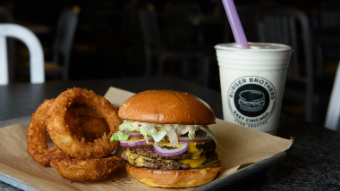 Burger and onion rings with a milkshake